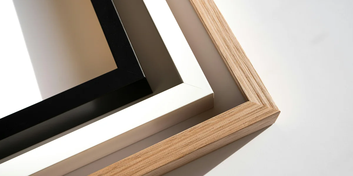 Close-up of a carpenter using a square and measuring tools on wood, showing geometric angles and precise measurements in woodworking
