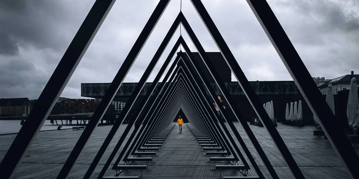 Extension ladder positioned at optimal 75-degree safety angle against building wall