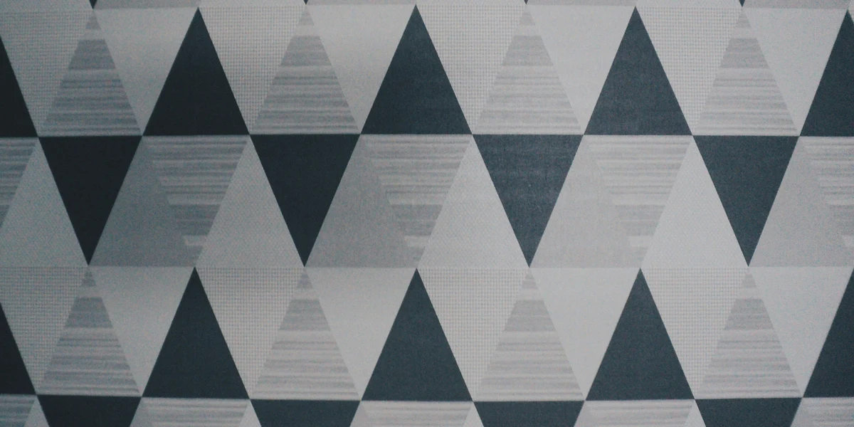 Student working on right triangle calculations with calculator and geometry homework