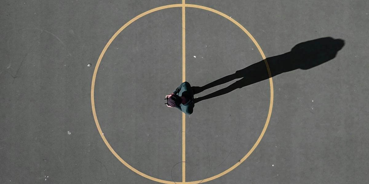 Person standing in a circle, representing a unit circle diagram